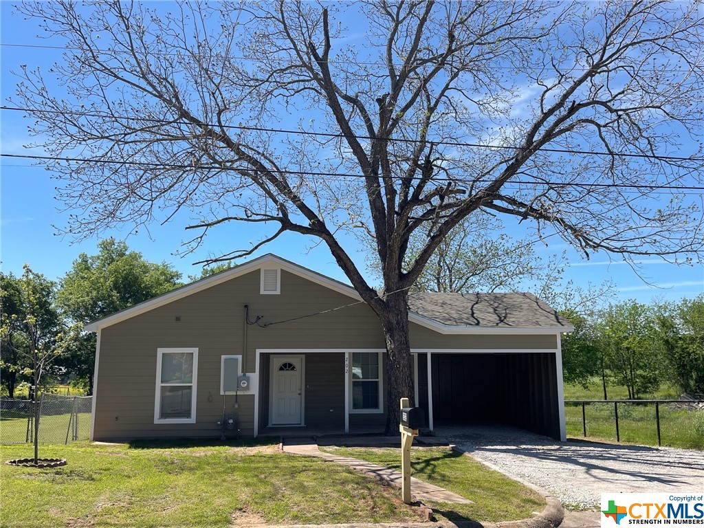 a house with trees in the background