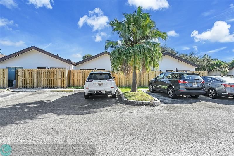 a view of a car parked in front of a house