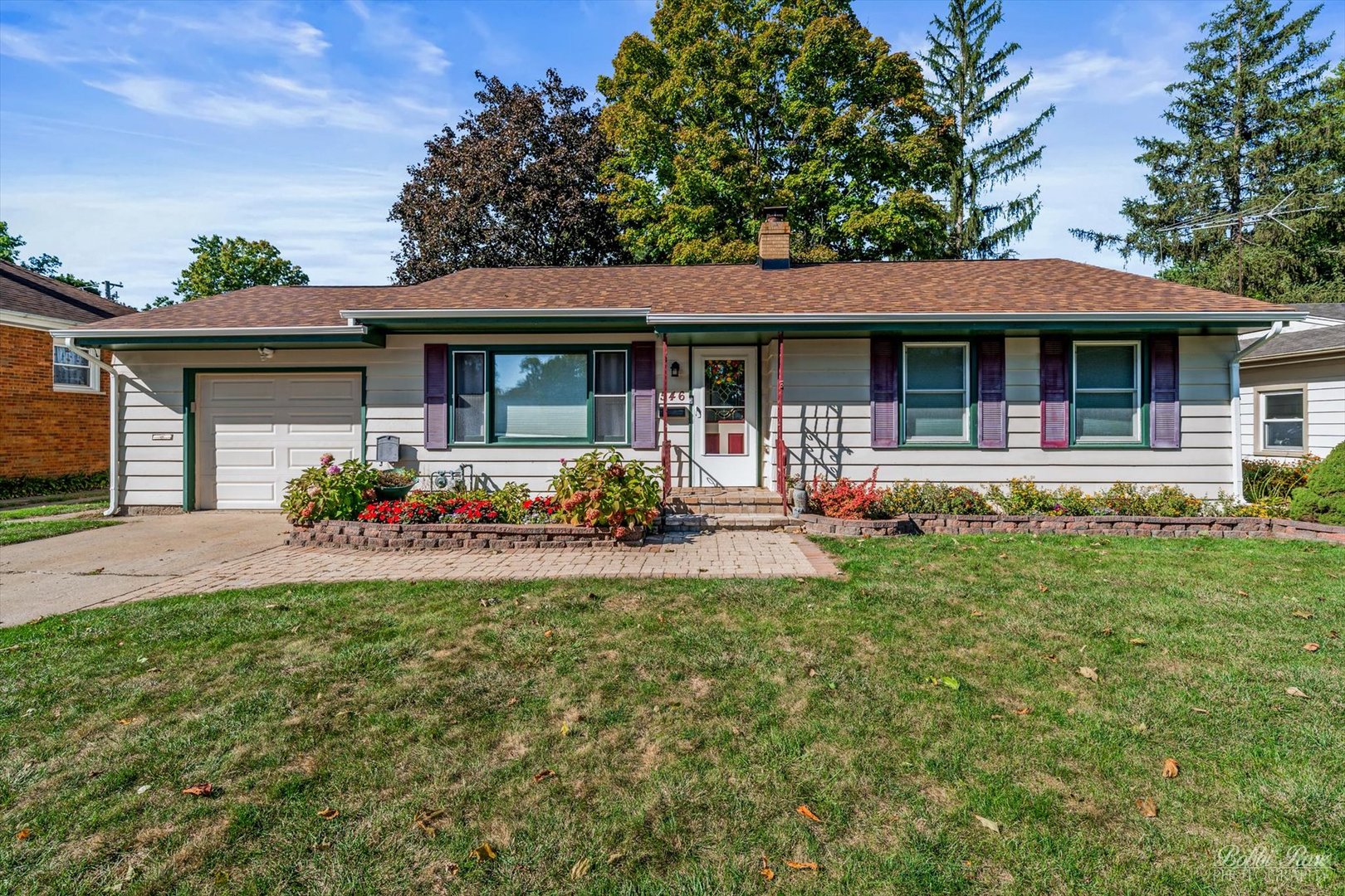 front view of a house with a yard