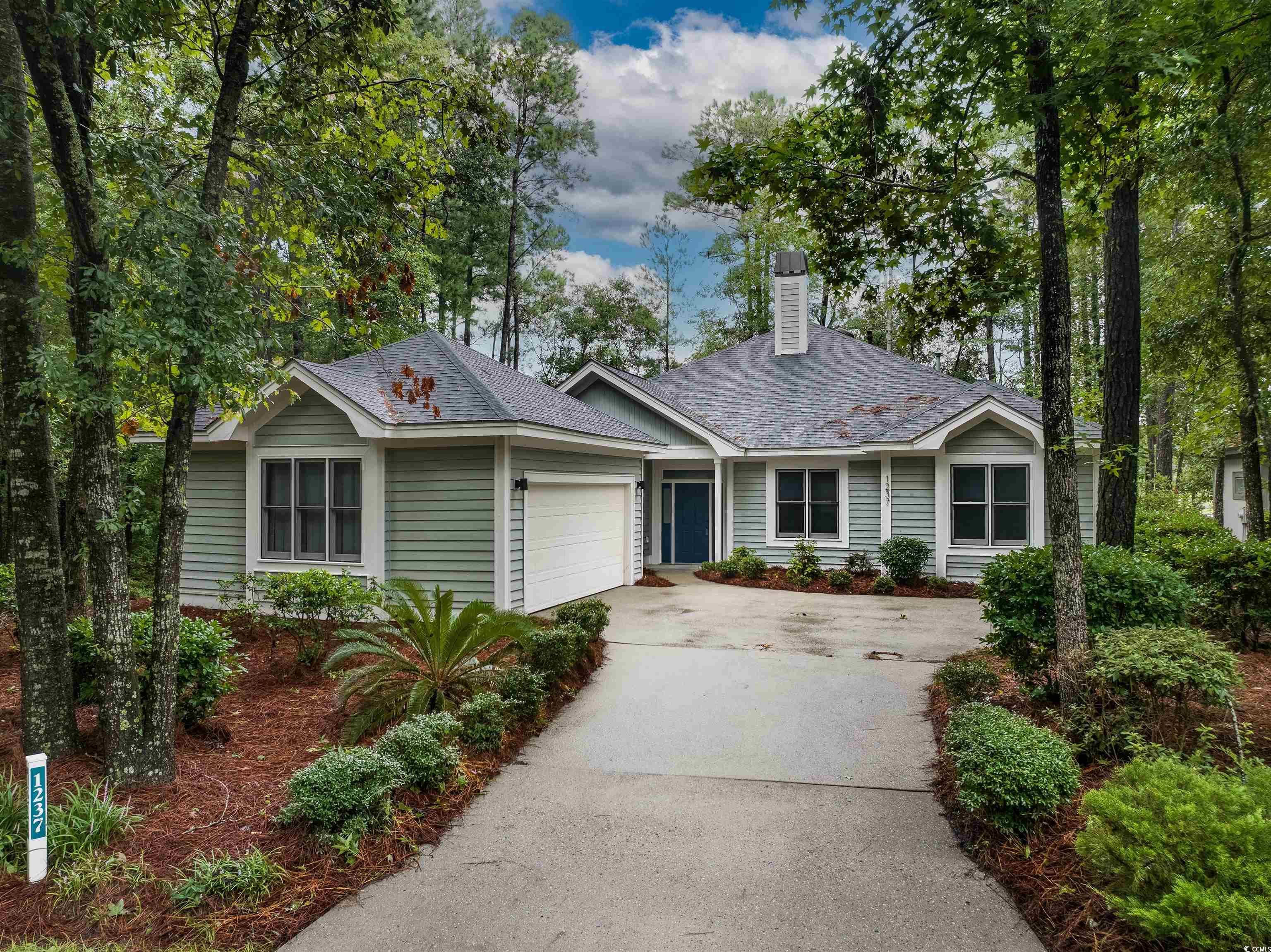 View of front of property with a garage