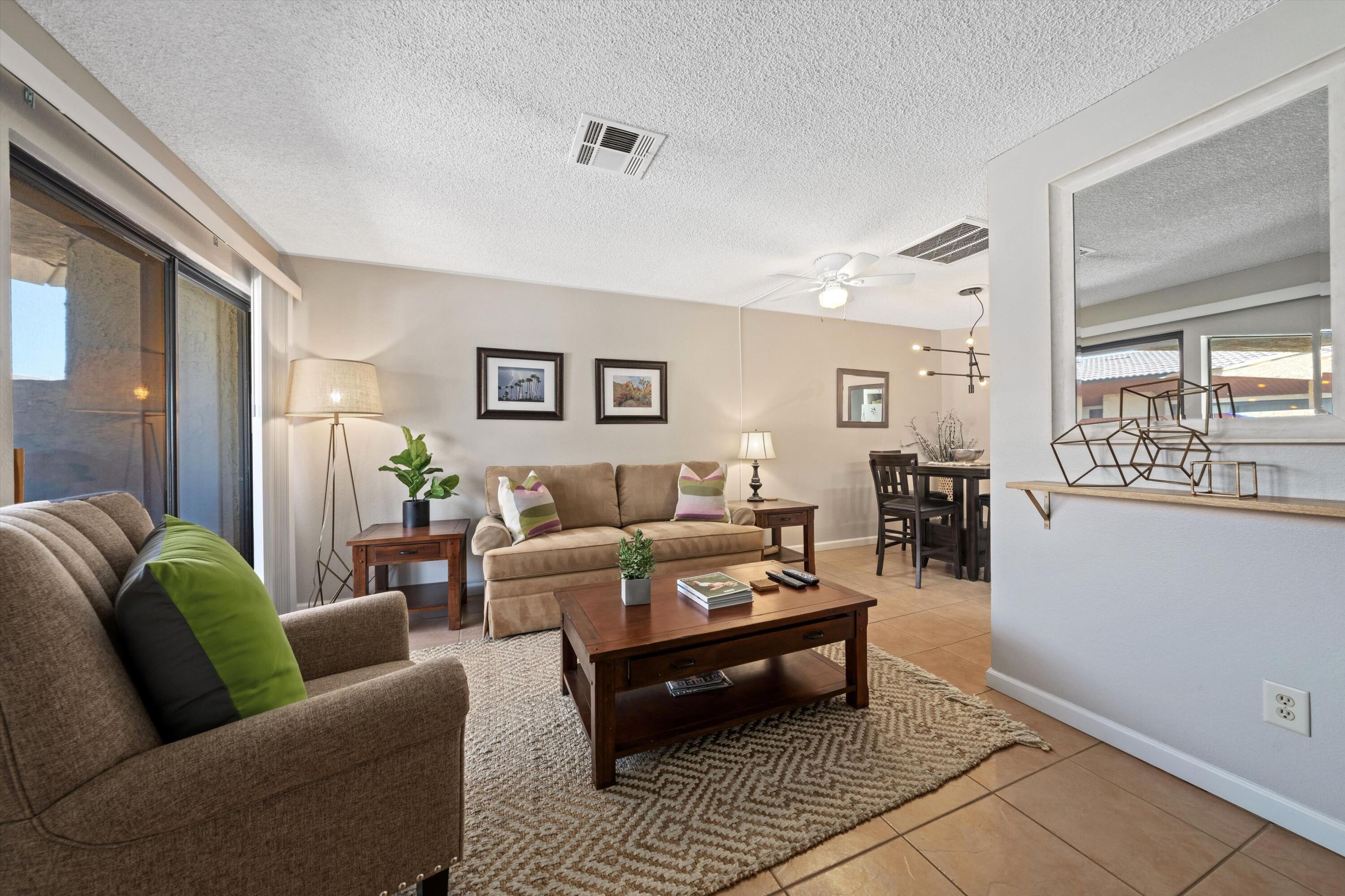 a living room with furniture and a rug