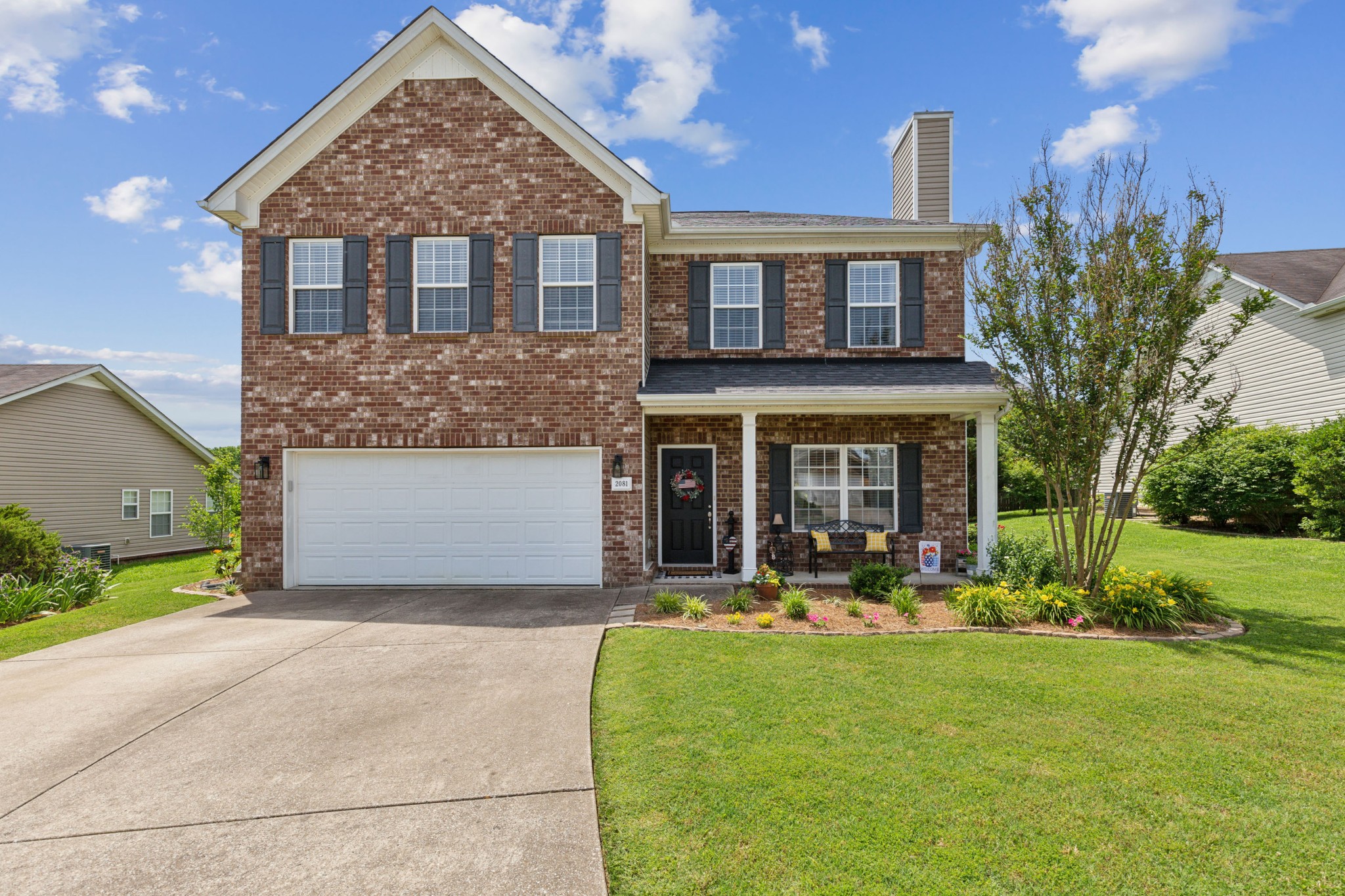 front view of a house with a yard