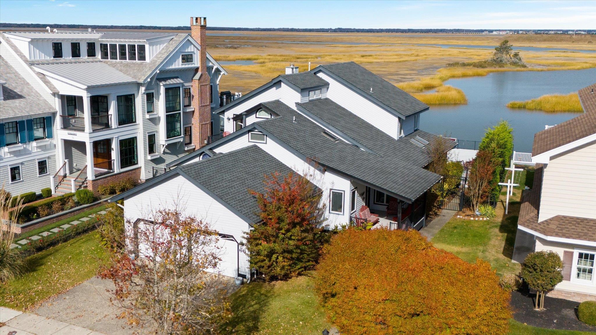 a view of a house with outdoor space and ocean view