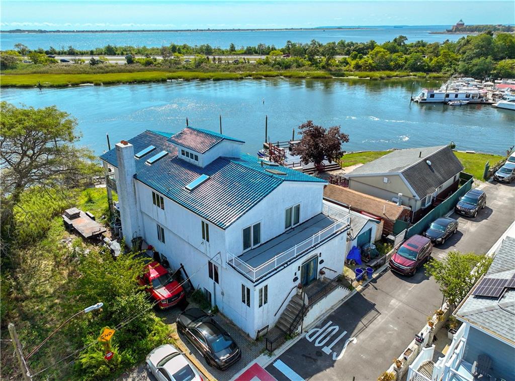 an aerial view of a house with lake view