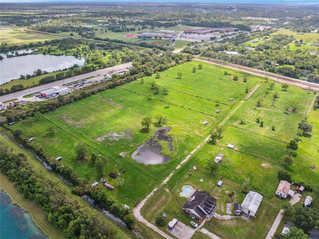 an aerial view of a residential houses with outdoor space