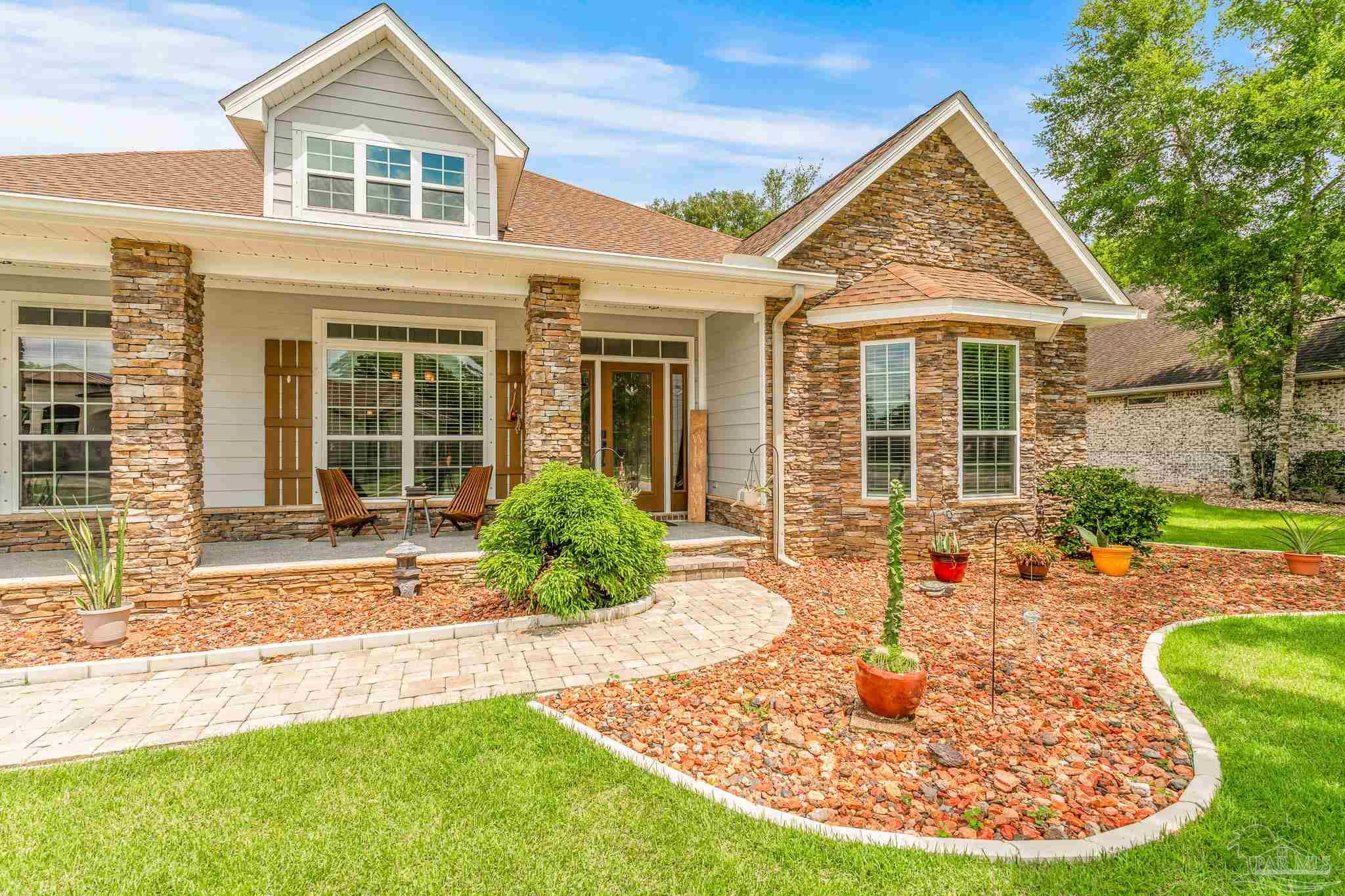 front view of a house with a yard