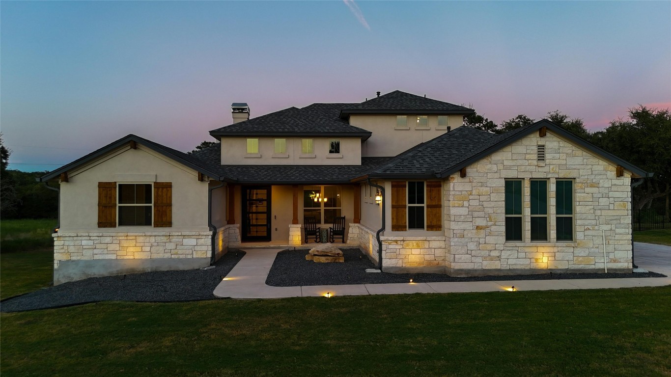 a front view of a house with a yard