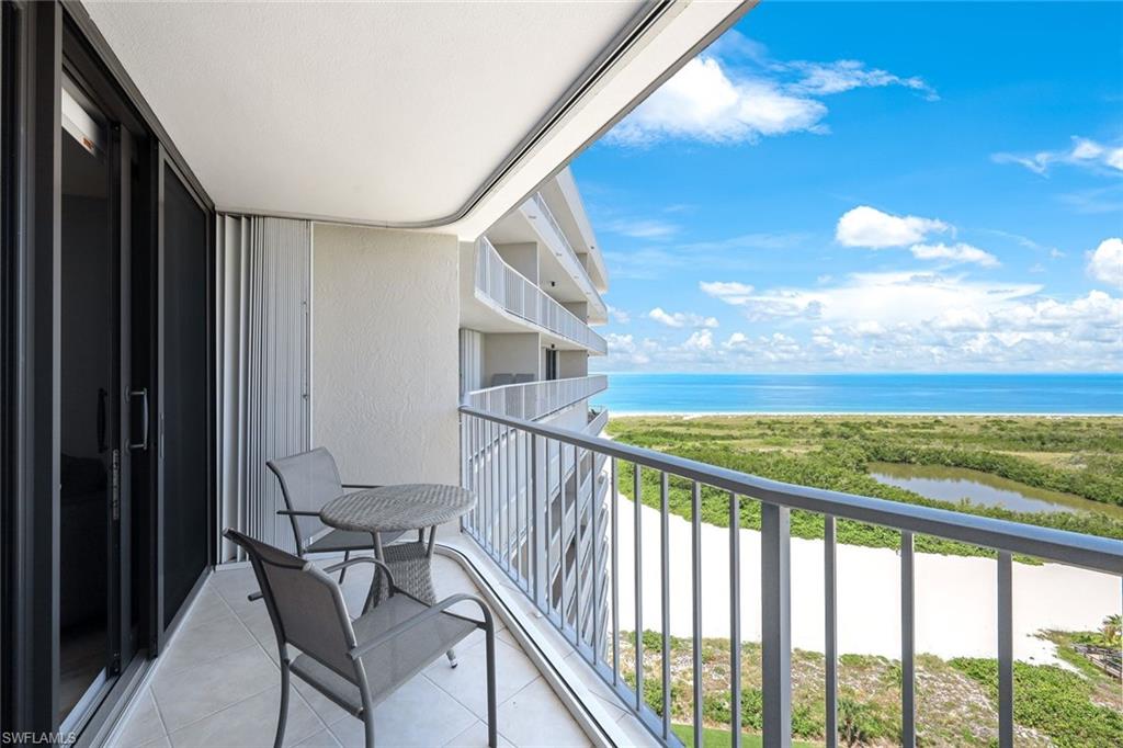 a view of a balcony with furniture