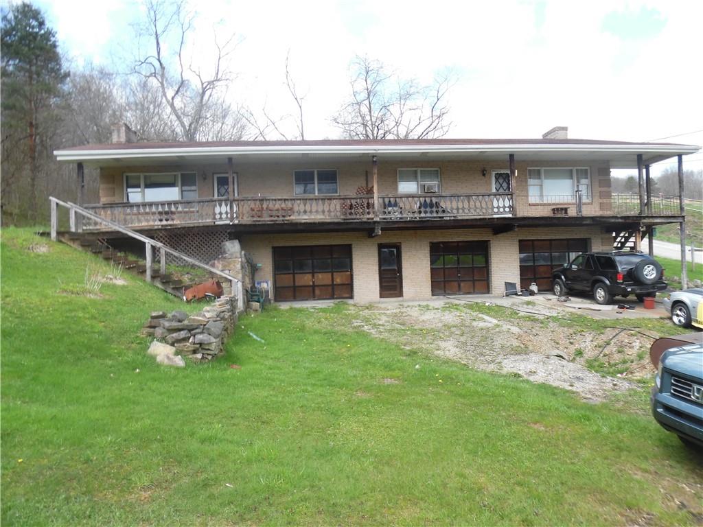 a front view of a house with a garden and porch