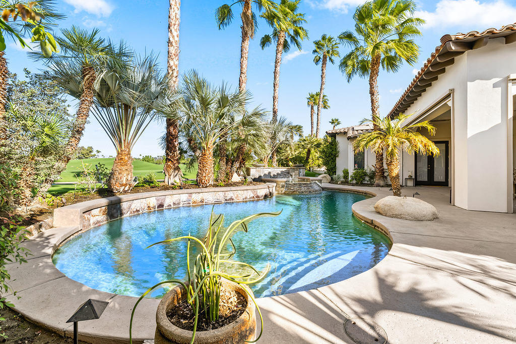 a view of a swimming pool with a patio