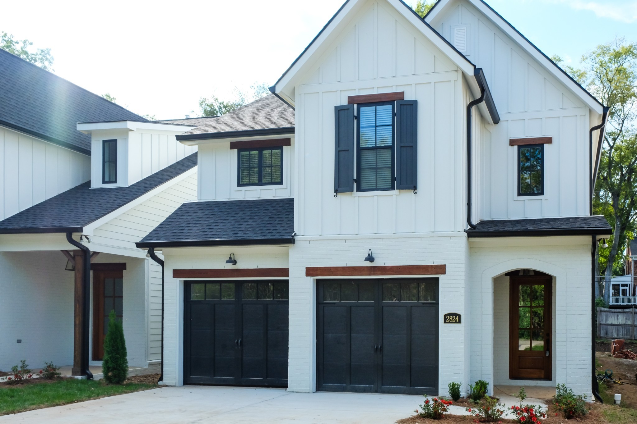 a front view of a house with garage