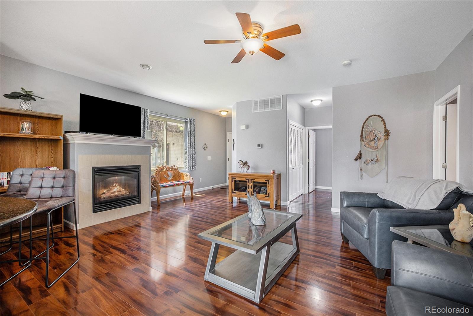 a living room with furniture fireplace and a flat screen tv