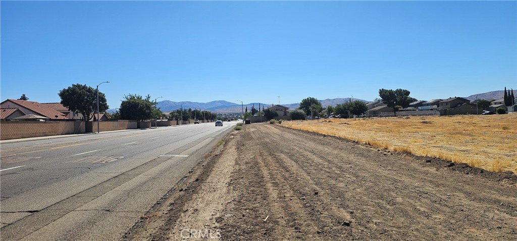 a view of a road with an ocean view