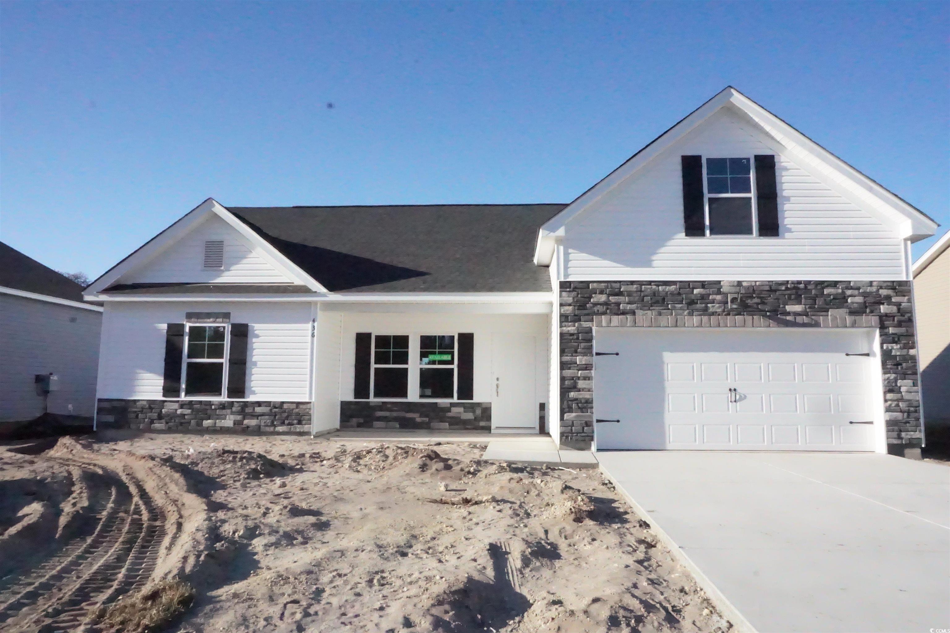 View of front of property with a garage