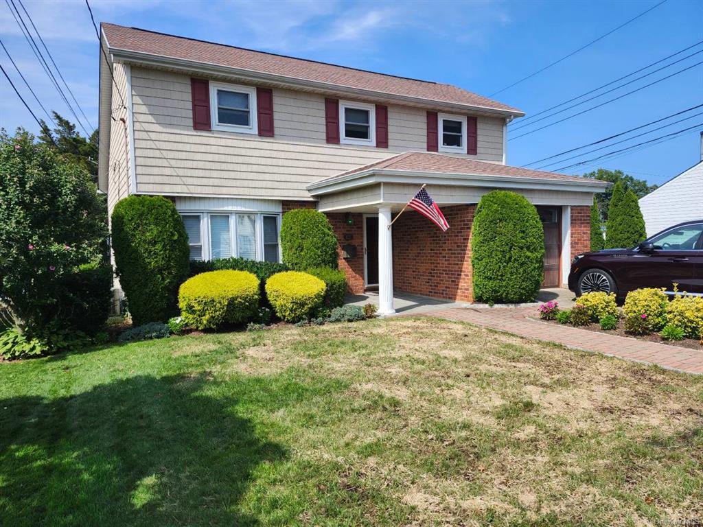 Front facade with a  lawn