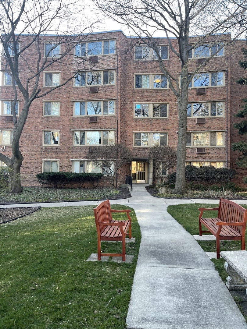 a swimming pool with outdoor seating and yard