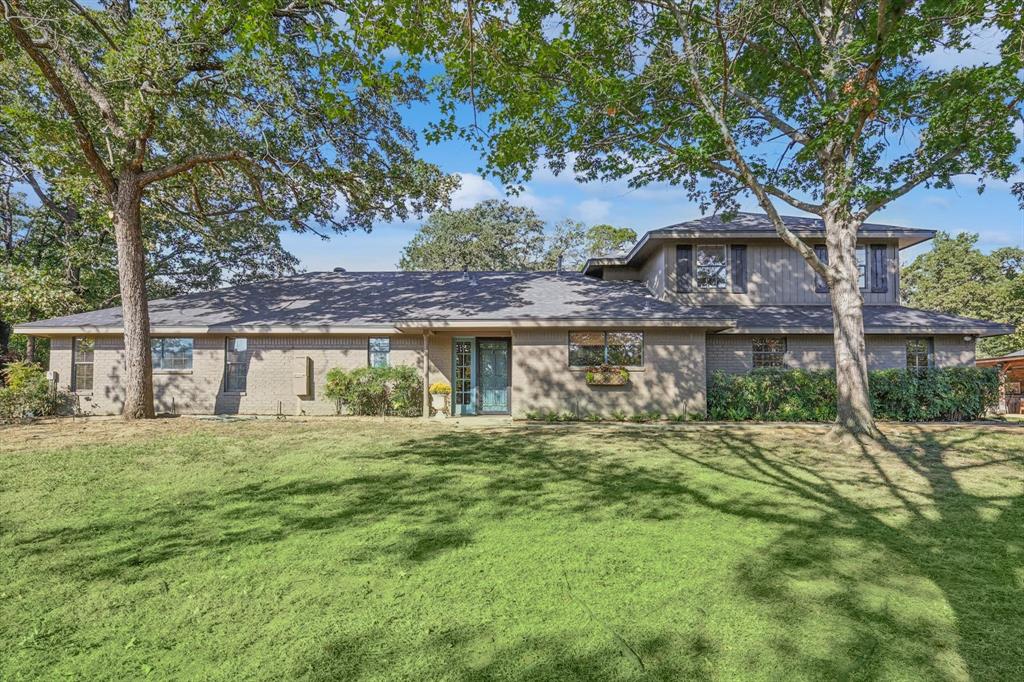 front view of a house with a big yard