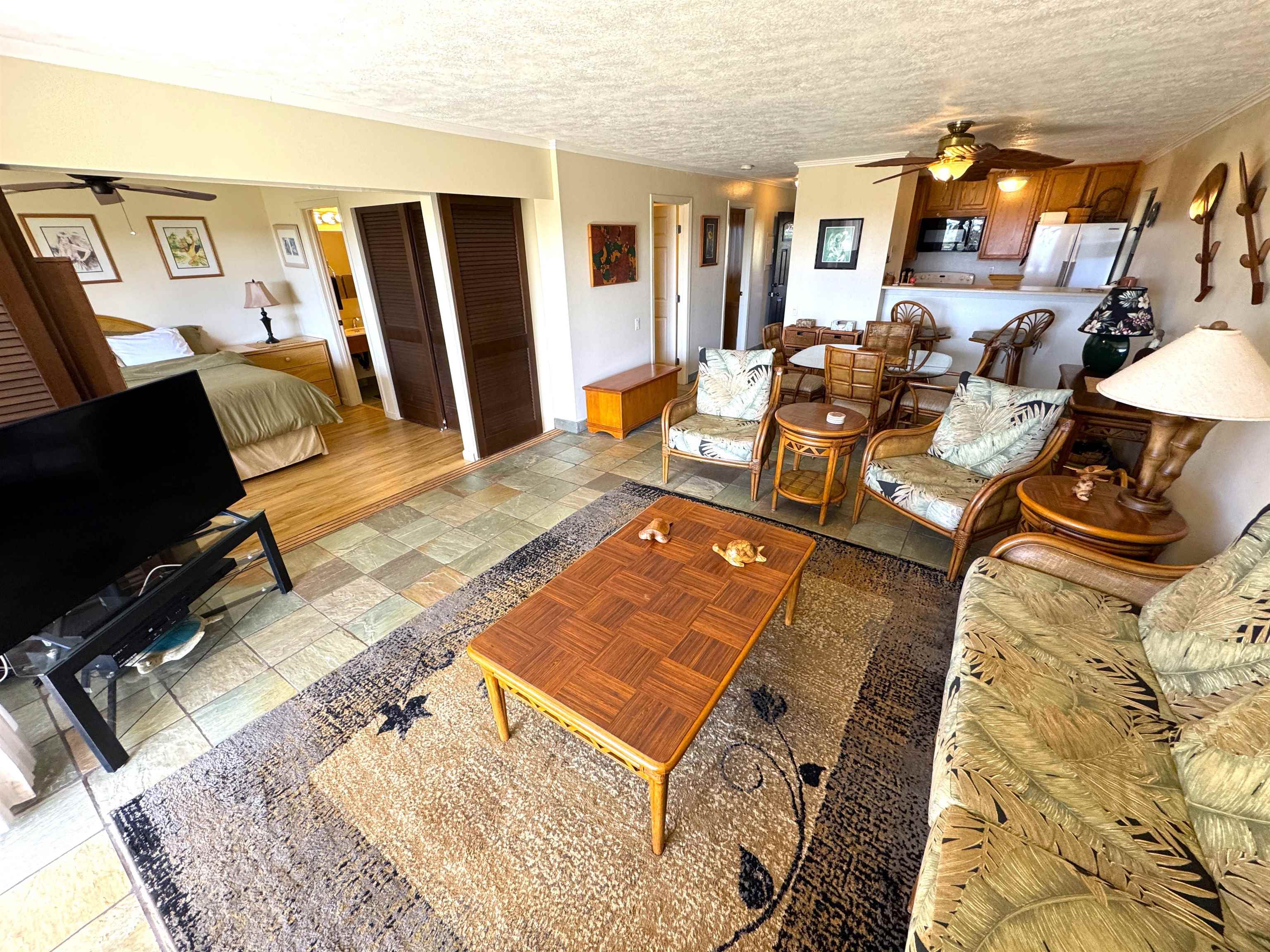 a living room with furniture and a rug