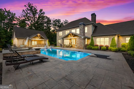 a view of swimming pool with lounge chair