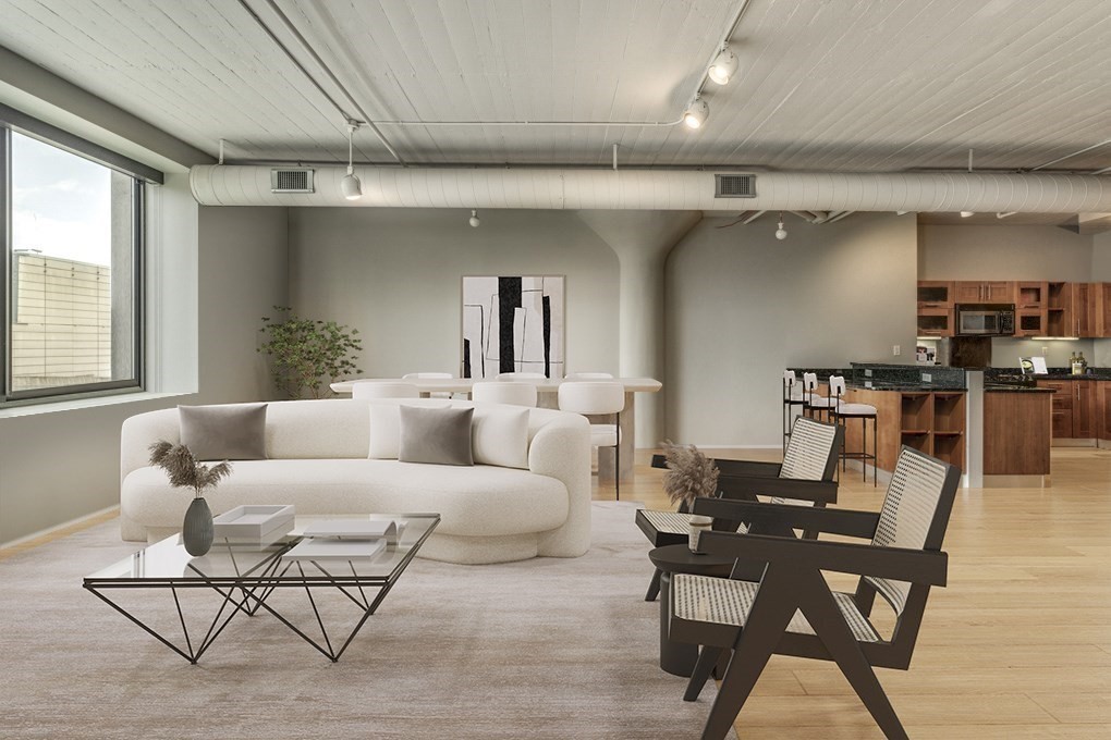 a living room with furniture and a table