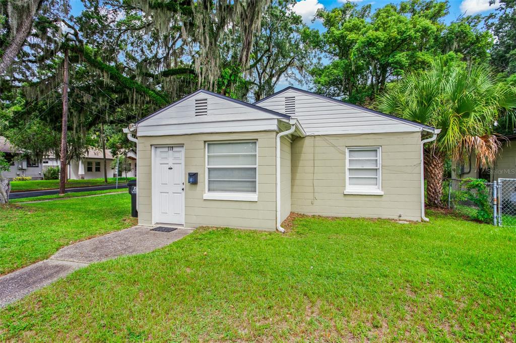 a front view of a house with a yard