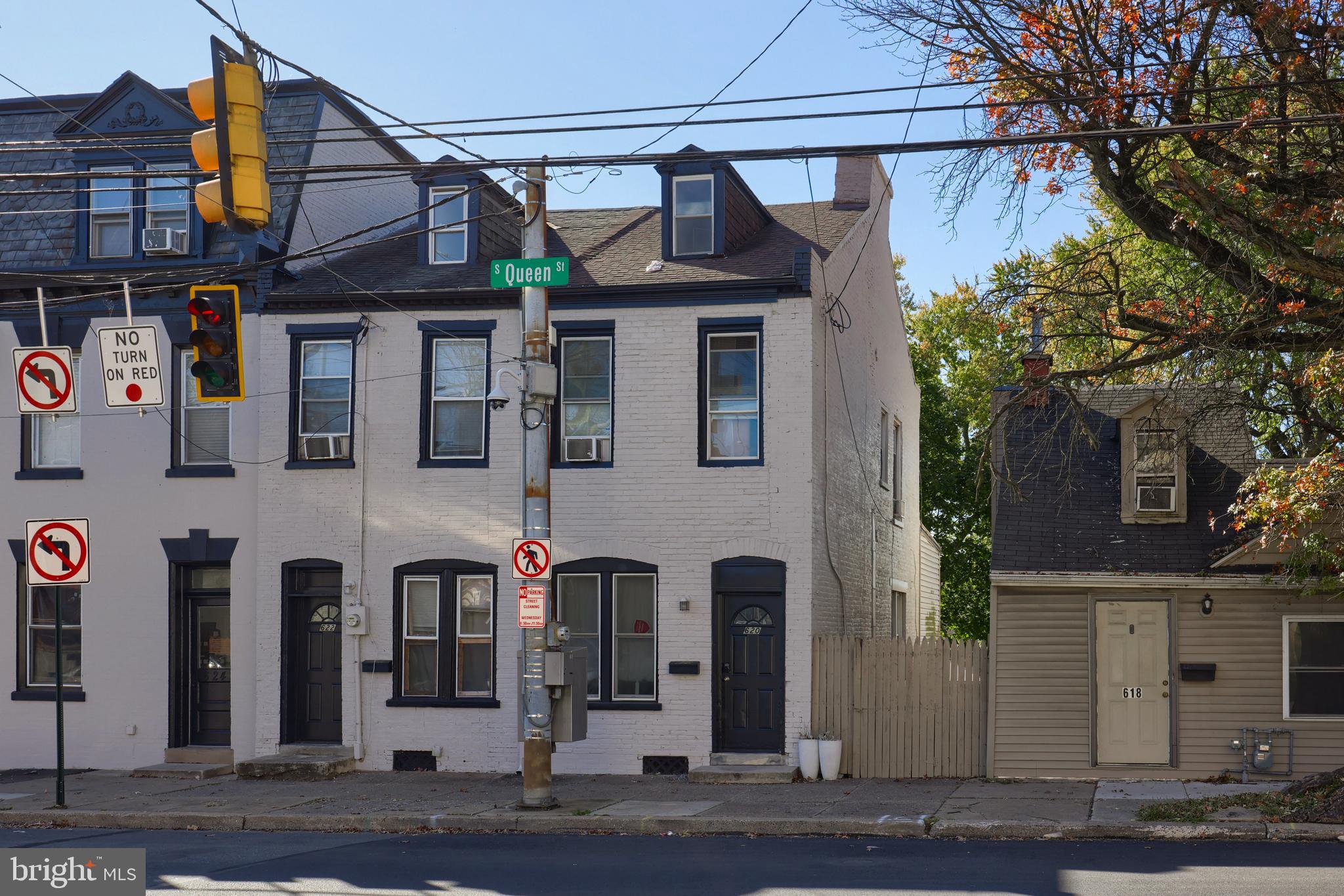 a front view of a building with a street