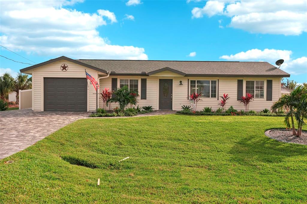 a front view of house with yard and green space