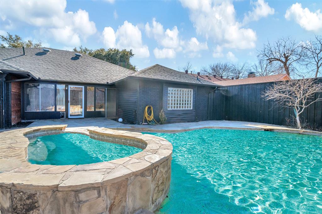 a view of swimming pool with a backyard