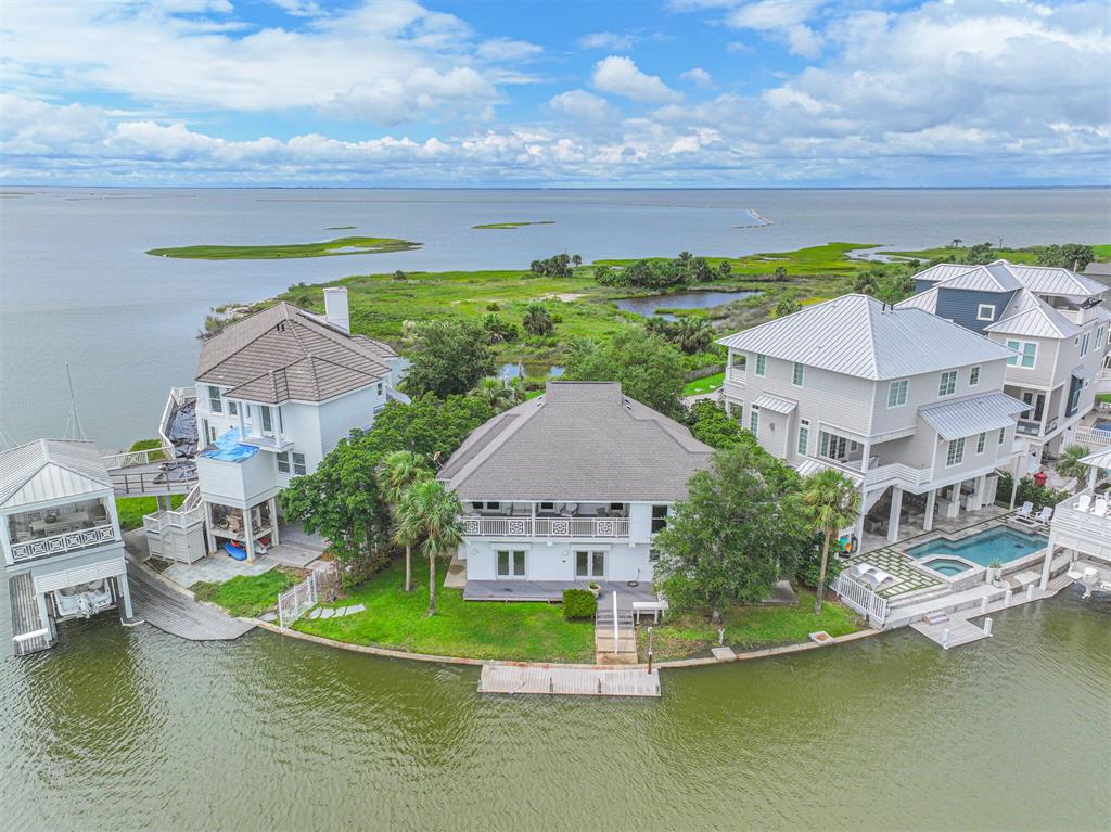 an aerial view of a house with a ocean view