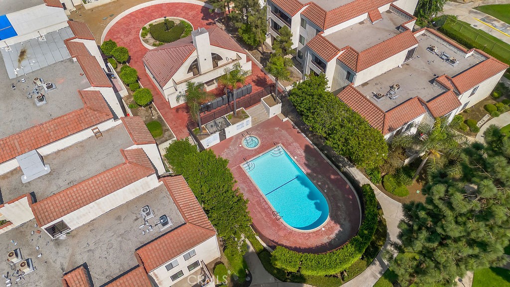 an aerial view of a swimming pool and outdoor space