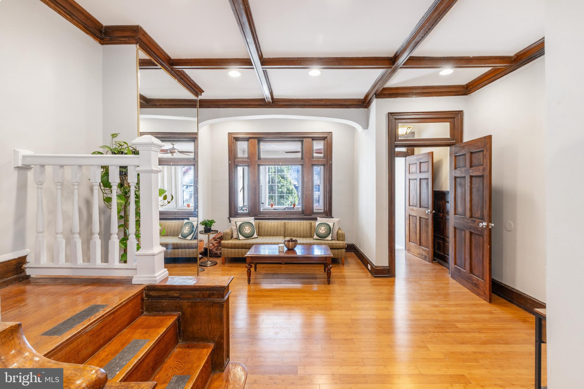 a lobby with furniture and floor to ceiling windows