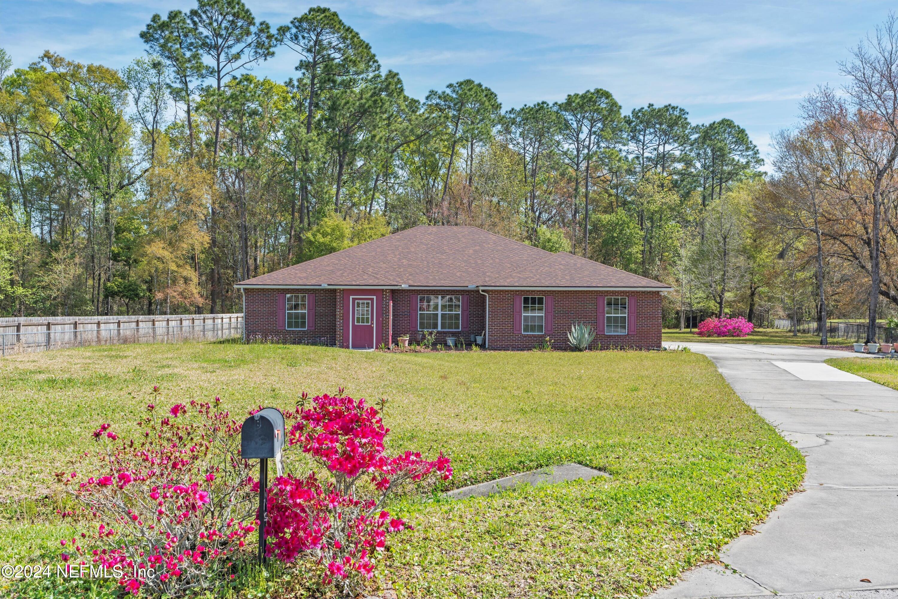 a front view of a house with yard