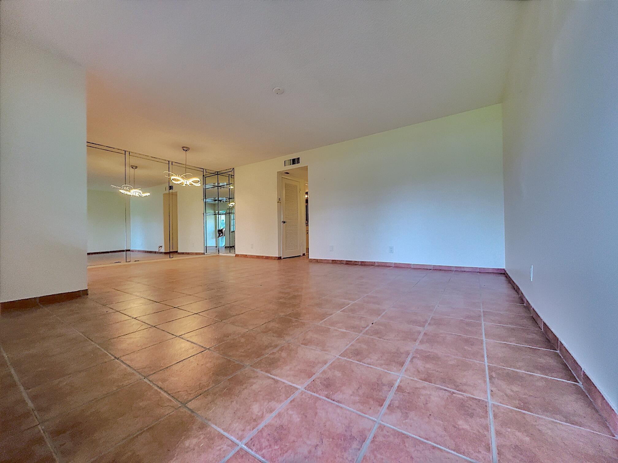 a view of a hallway with a room