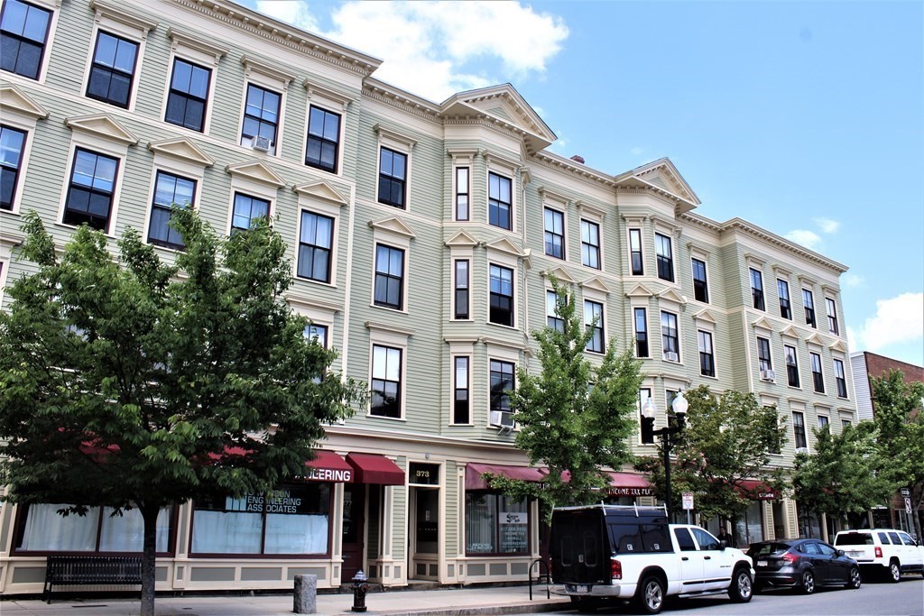 a front view of a building with street view