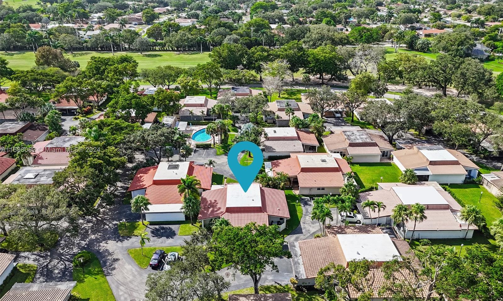 an aerial view of a house with a garden