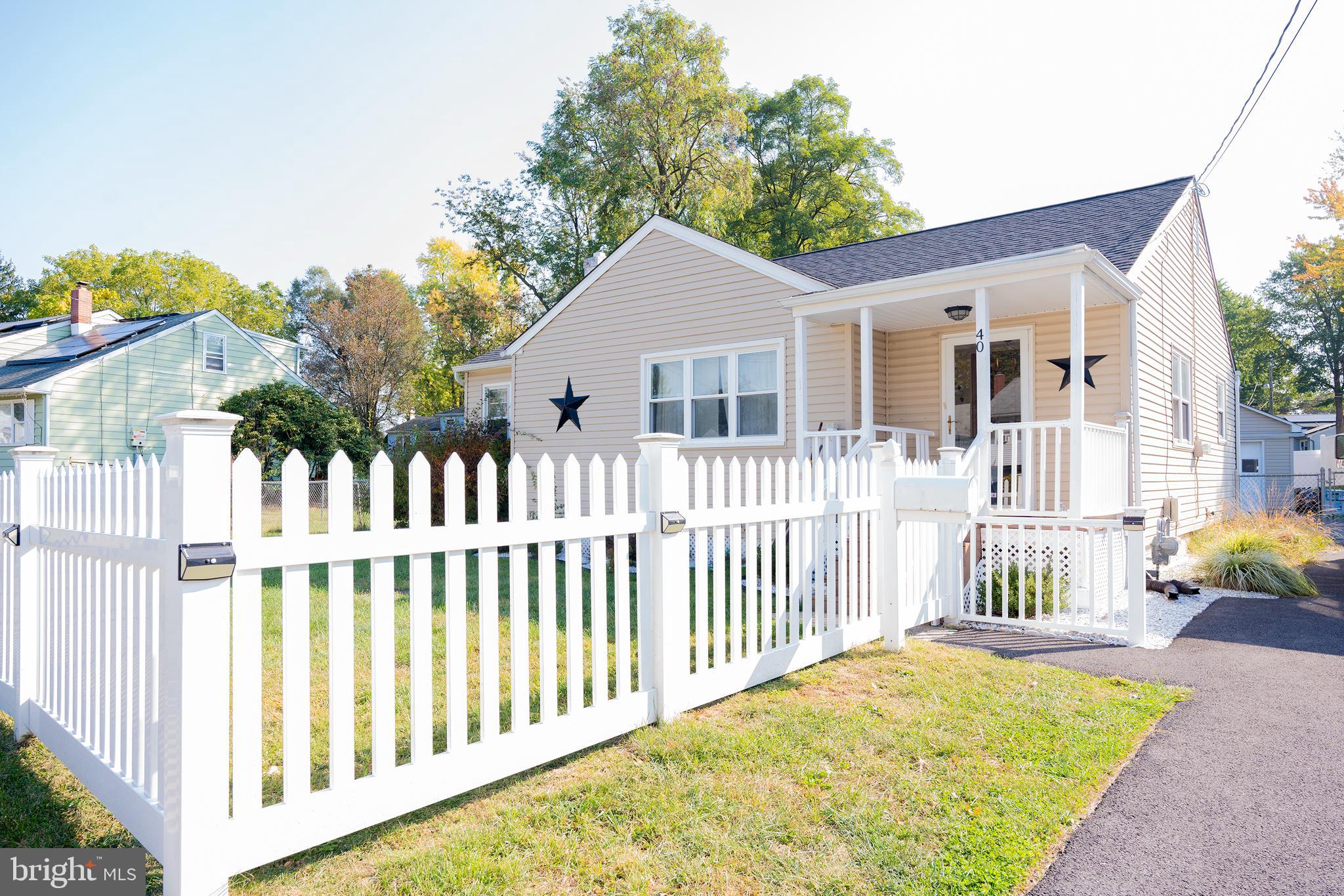 a view of a house with a wooden deck