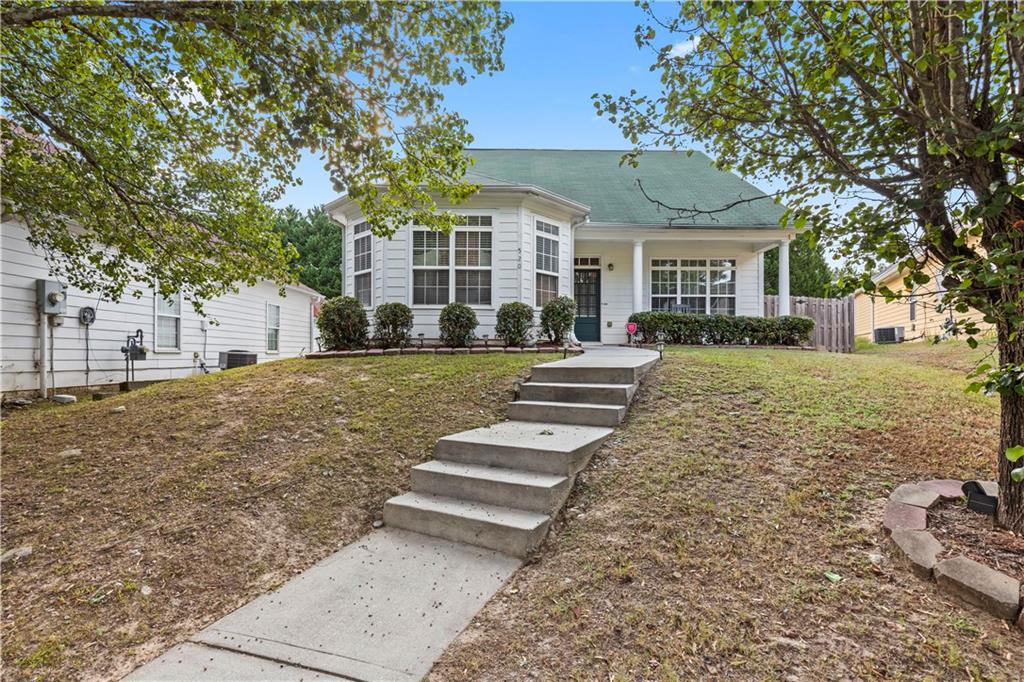 a front view of a house with a yard