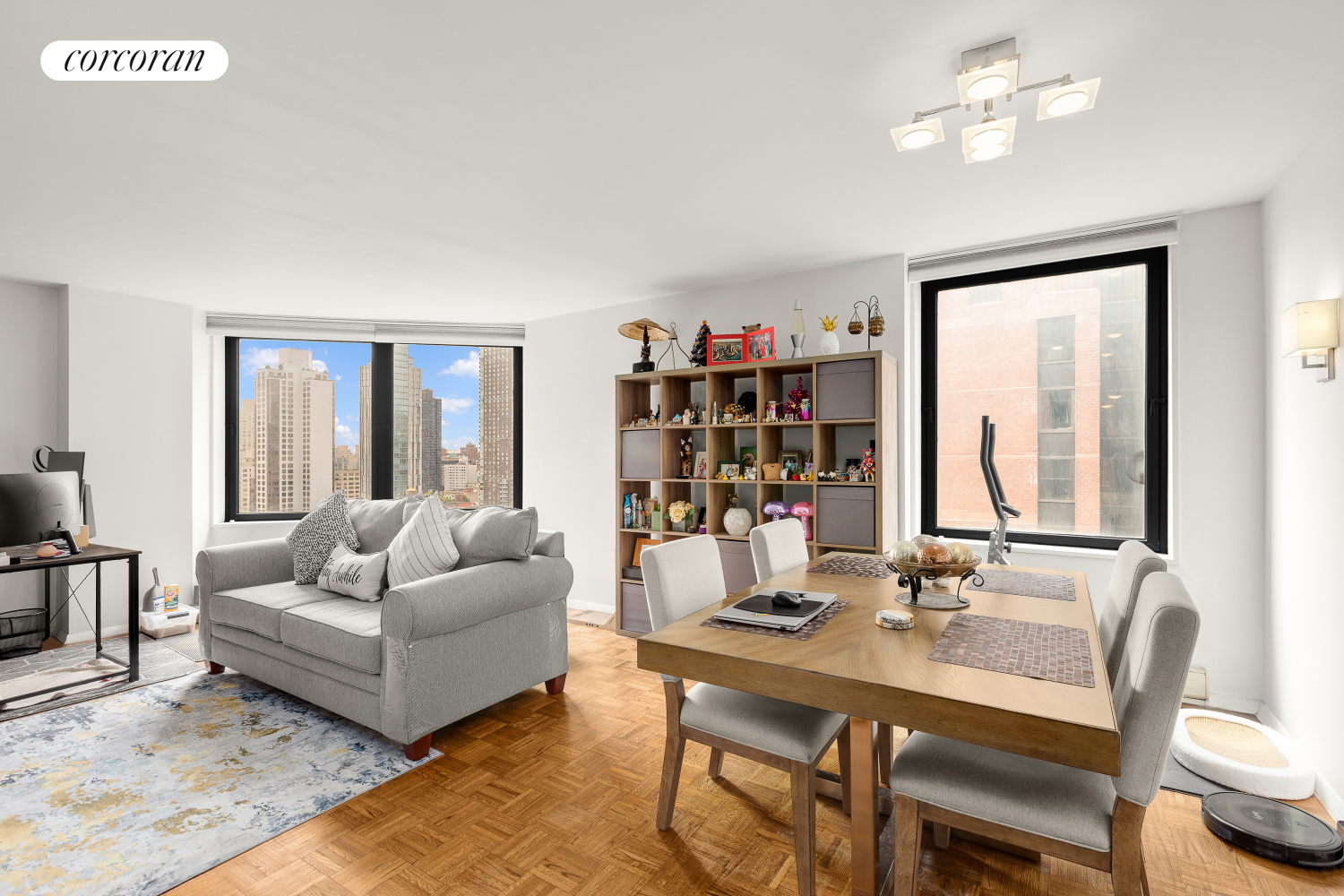 a living room with furniture and a bookshelf