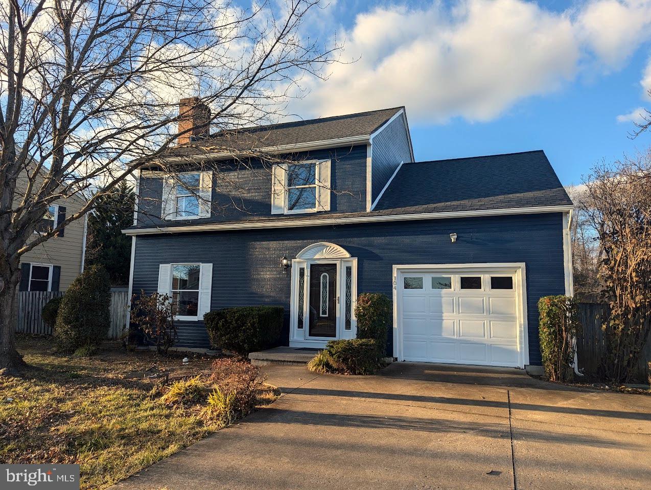 a front view of a house with garage