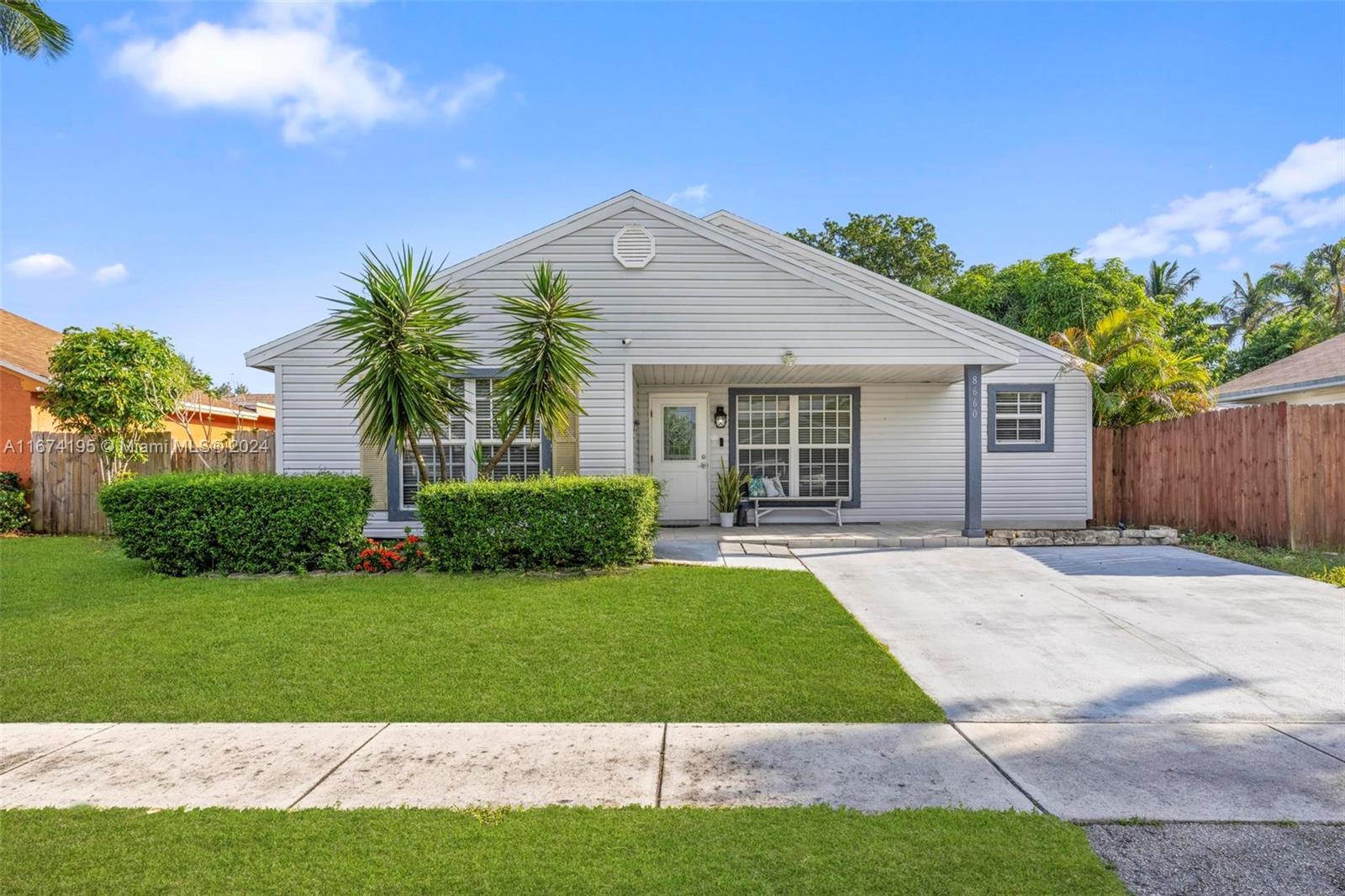 front view of a house and a yard