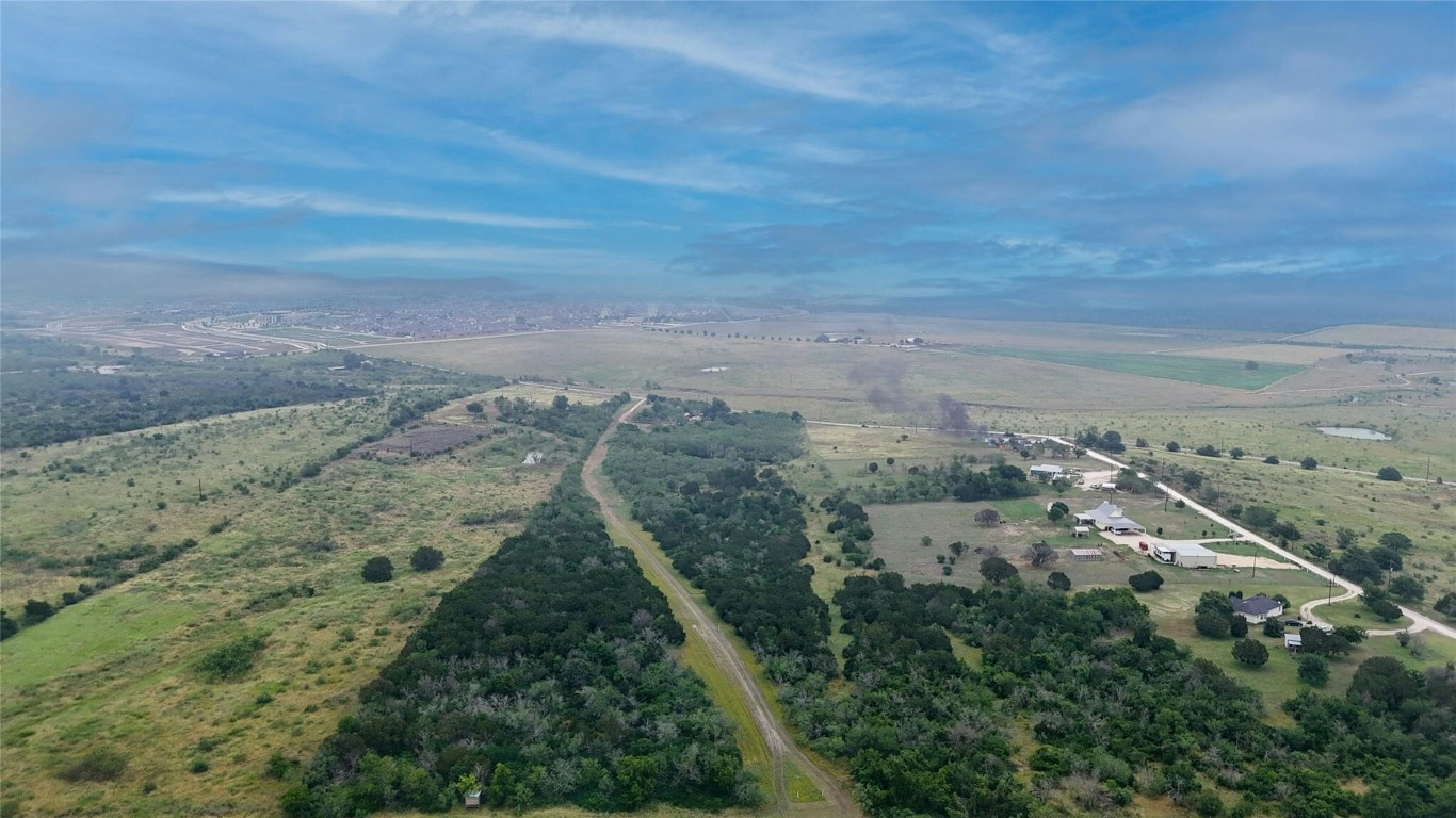 an aerial view of house with yard