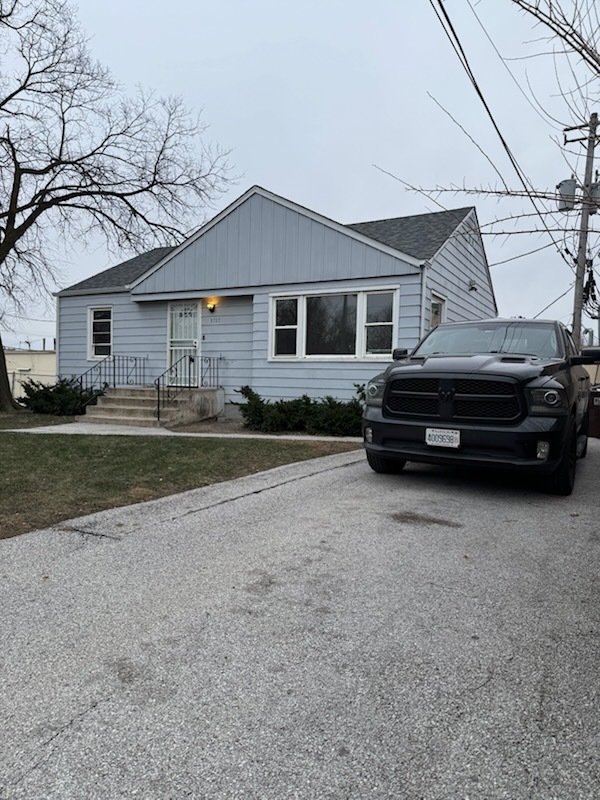 a car parked in front of a house