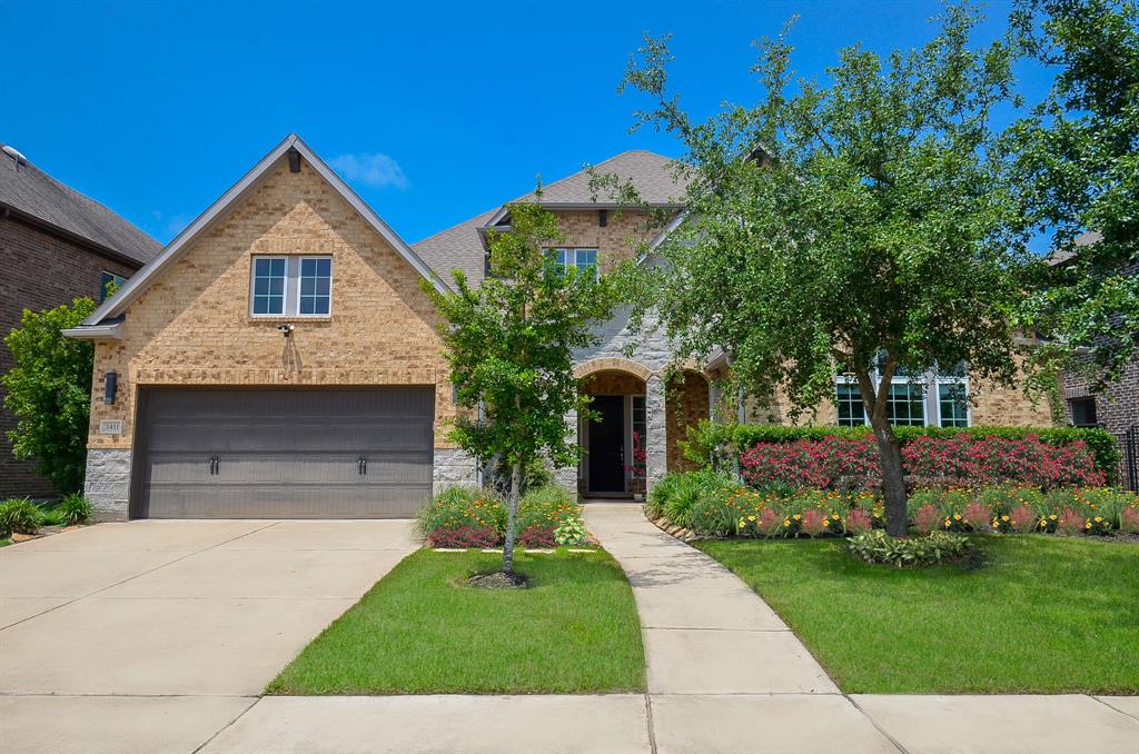 Welcome Home to 3411 Sunrise Garden Path in the Coveted Neighborhood of Harvest Green!