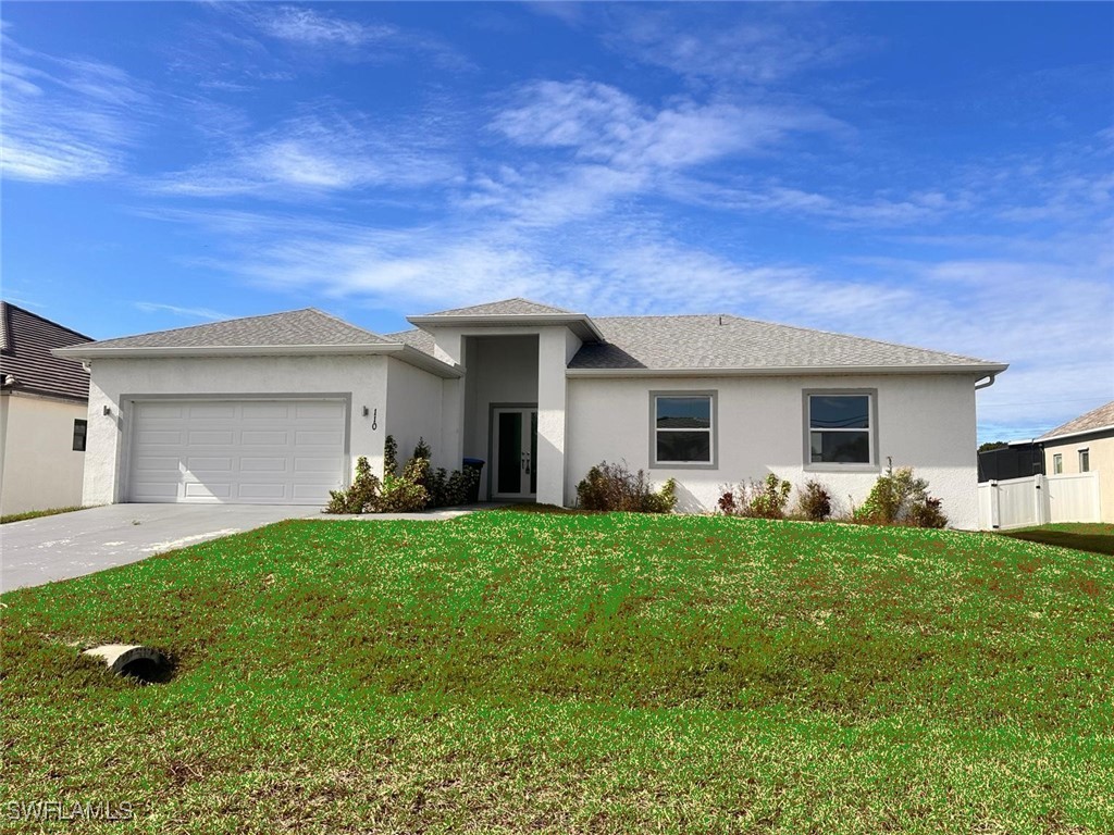 a view of a house with a backyard