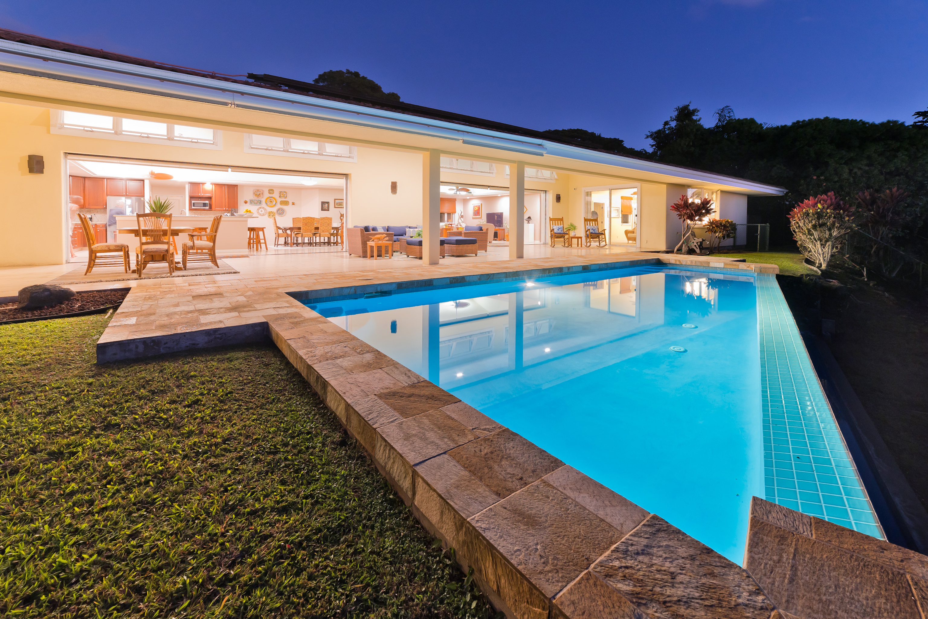 Welcome home.  This photo captures the amazing open flowing floor plan of this residence.  Approx 784 square feet of covered lanai space with direct access to living room, kitchen and dining areas along with Primary and Junior Suites.