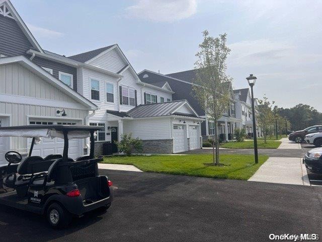 a car parked in front of house with a yard