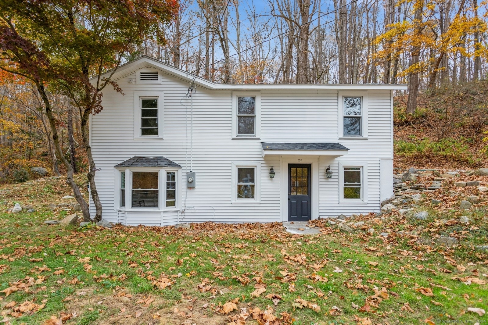 a view of a house with a yard