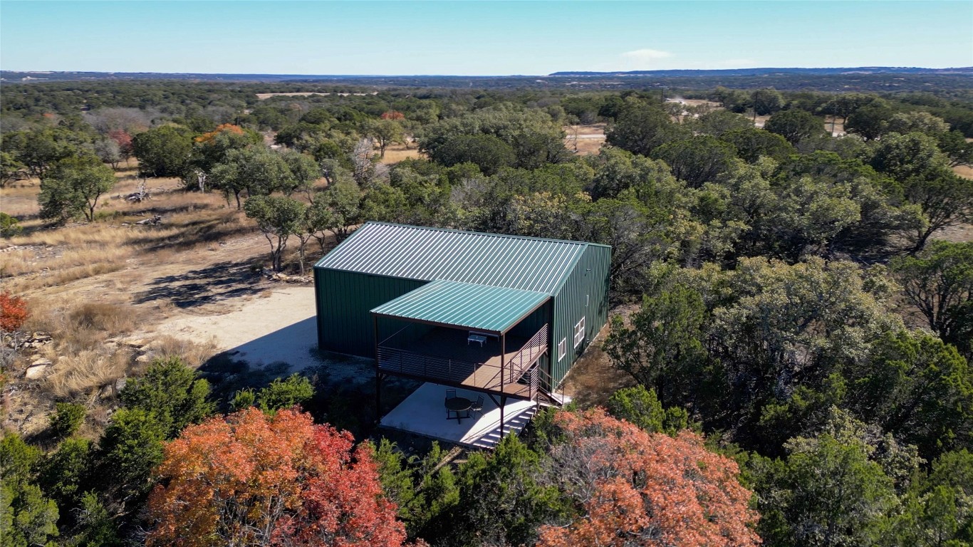 an aerial view of a house with mountain view