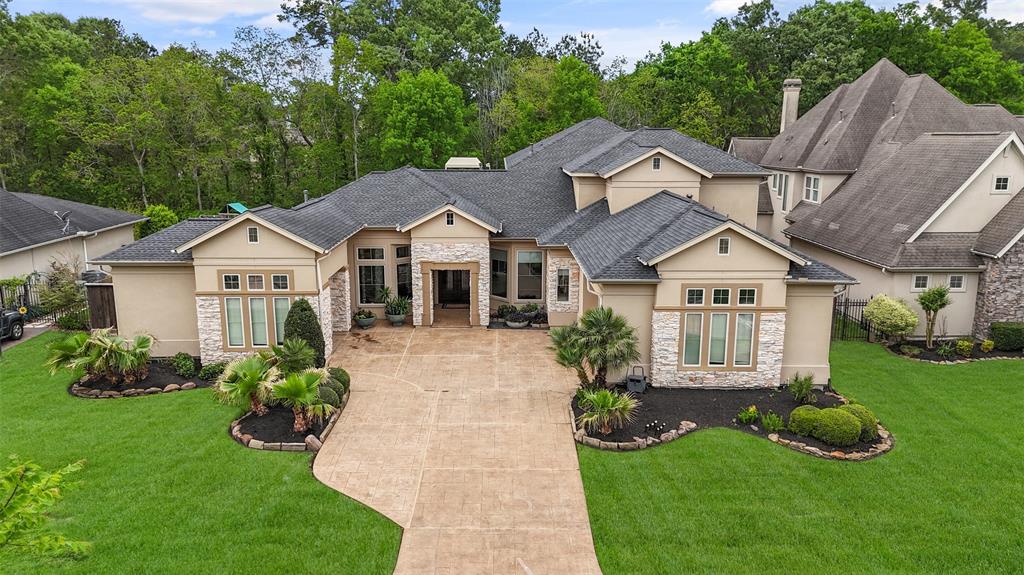 Stunning Kings Point Custom home with stucco and stone exterior.