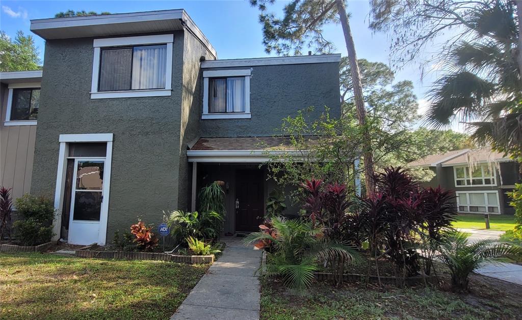 a front view of a house with garden